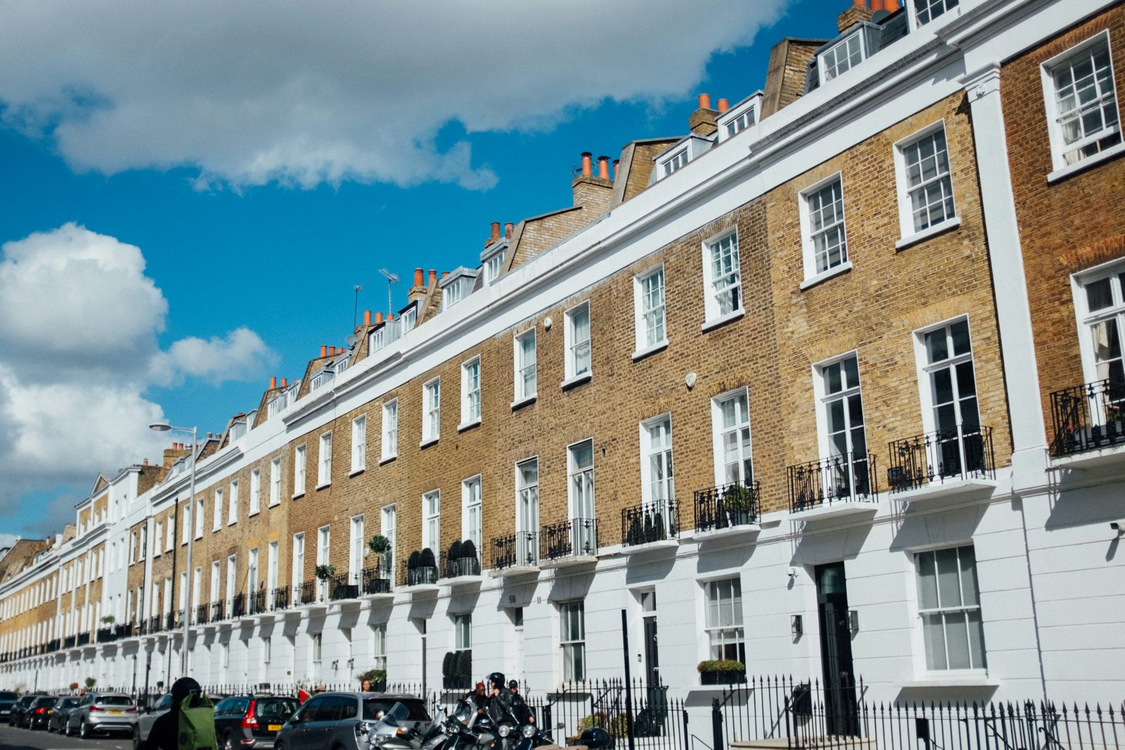 File photo of a row of terraced houses in London beneath a blue sky.